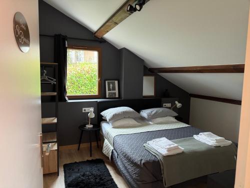 a bedroom with a bed and a window at Lyon Mon Amour Bed and Breakfast in Lyon