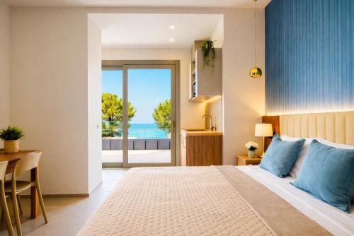 a bedroom with a bed and a view of the ocean at Frontemare Appartamenti e Camere ELISABETTA in Cesenatico