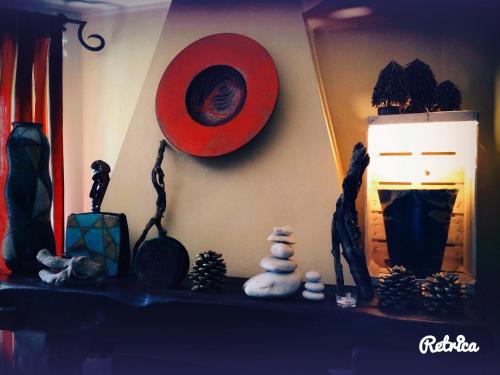 a shelf with a red hat and other items on it at Il Peschio in Pescocostanzo
