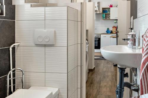 a small bathroom with a sink and a toilet at Ferienhaus Salzwedel in Salzwedel