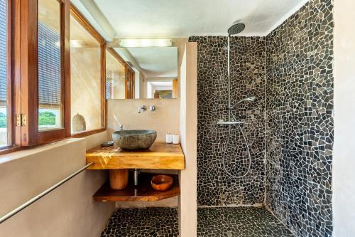 a bathroom with a sink and a shower at Sa Paret Nova in Sant Francesc Xavier