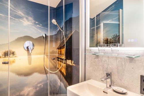 a bathroom with a shower and a sink at Ferienwohnungen Arnspitz in Krün in Krün