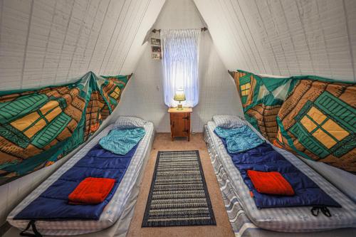 a room with two beds and a window at Hilltop Loft in Helen