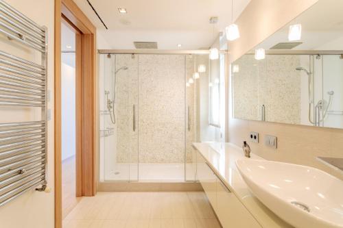 a bathroom with a shower and a sink at Mediterranean Beach in Arenales del Sol