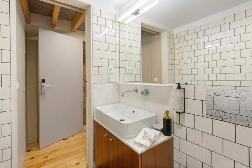 a bathroom with a sink and a mirror at Orange Apartments B in Porto