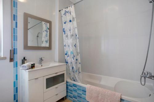 a bathroom with a tub and a sink and a shower at A O - Tina House Ferrel in Ferrel