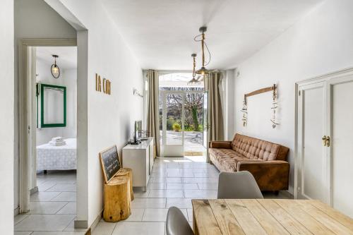 a living room with a couch and a table at Masia Cal Ros in S'agaro
