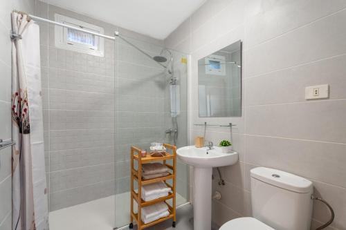 a bathroom with a sink and a toilet and a shower at Sunset Lux Las Floritas in Arona