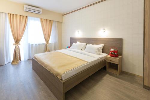 Hotel Sabor tesisinde bir odada yatak veya yataklar