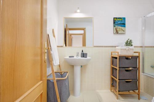 a bathroom with a sink and a mirror at Casa Vicente Majanicho in Lajares