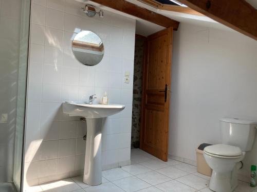 a bathroom with a sink and a toilet at Chez Bonneau in Nantiat