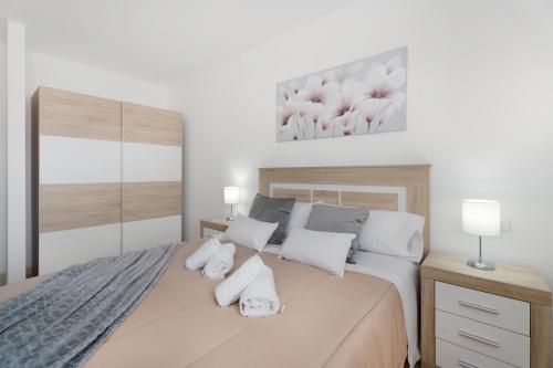 a bedroom with a bed with two towels on it at Apartamento Gabriela in Candelaria