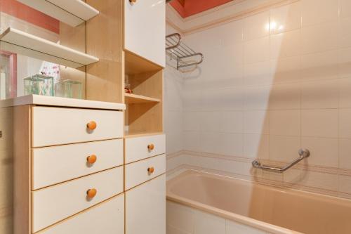 a bathroom with a sink and a bath tub at Casa Paradise Jannest in Adeje