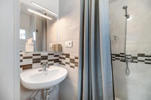 a bathroom with a sink and a shower at Kays studio in Puerto del Carmen