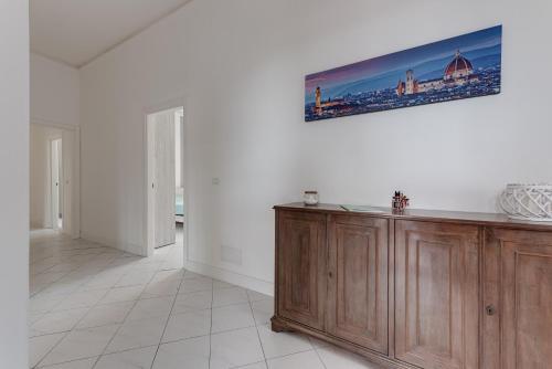 a living room with a picture on the wall at Giada Apartment in Calenzano