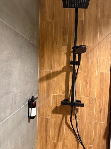 a bathroom with a shower stall with a hair dryer at Kutnowska Perła in Kutno