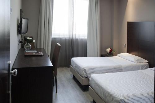 Llit o llits en una habitació de L'Angolo