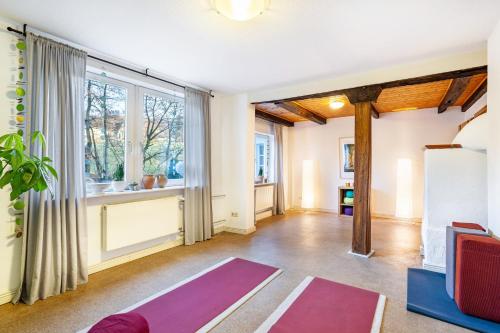 a living room with yoga mats and a window at Ferienhaus Titz in Sundern