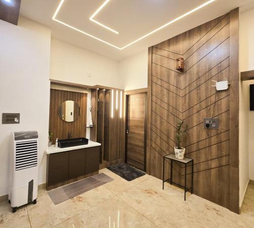 a bathroom with a sink and a mirror at CRK Home Stays in Cochin
