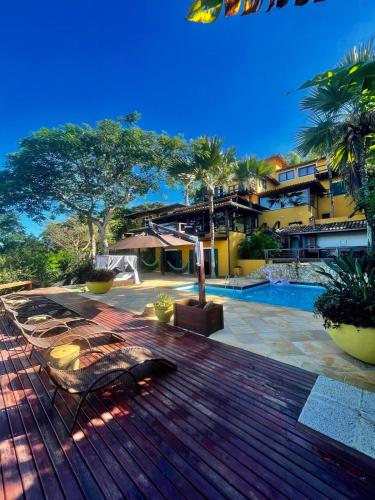 a view of a house with a swimming pool at FERRADURA EXCLUSIVE SEaVIEW in Búzios
