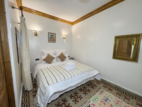 a bedroom with a bed in a room at Dar lalla Malika in Rabat