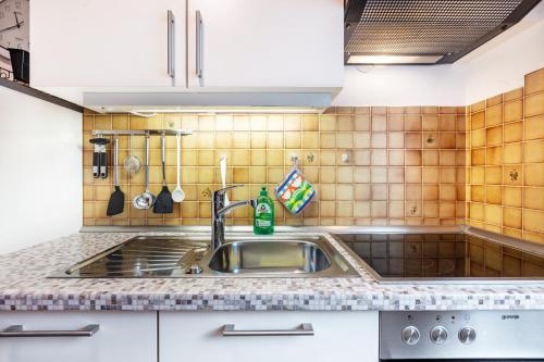 a kitchen with a sink and a counter top at Glöcklehof in Todtnau