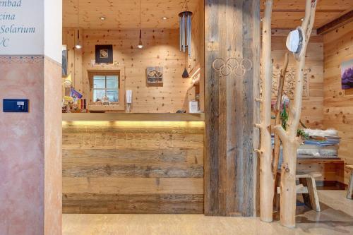 an inside view of a room with wooden walls at Hotel Residence Olympia Sarntal in Sarntal
