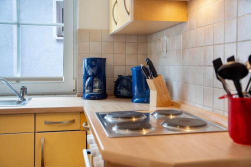 a kitchen counter with a stove top in a kitchen at Haus Seeadler Wohnung 13 in Koserow