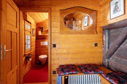 a small room with two beds in a wooden cabin at Schwarzwaldcasa in Todtmoos