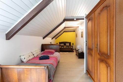 a bedroom with a bed in a room at L'abreuvoir du Leffo in Allineuc