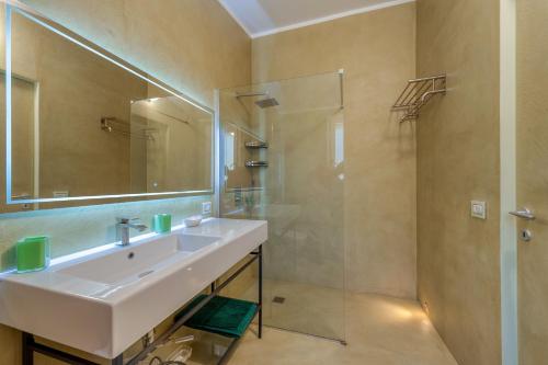 a bathroom with a sink and a shower at Le dimore di Elia in Lecce