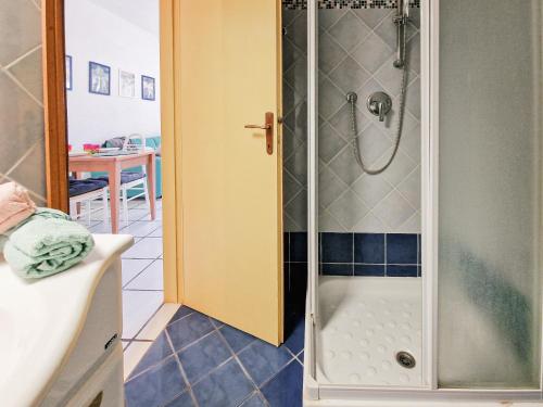 a bathroom with a shower with a toilet and a sink at Mono Le Lecce 53 Iris in Capoliveri