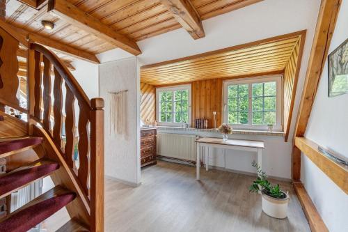 a home office with a staircase and a desk at Fernblick in Behrensdorf