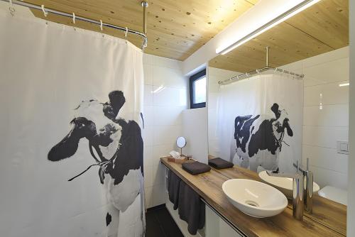 a bathroom with a toilet and a sink and a shower at Charmingsuite in Bad Teinach-Zavelstein