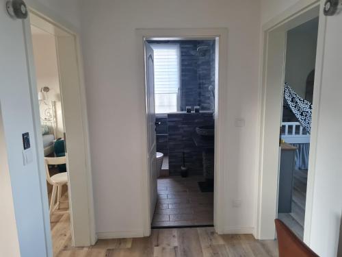a hallway with a door leading into a room at Maisonette-Wohnung in Gladbeck in Gladbeck