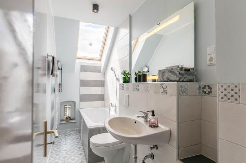 a bathroom with a sink and a toilet at Ferienwohnung mit großem Garten in Lindow