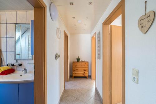 a bathroom with a sink and a mirror at am Hirnach in Sindelfingen