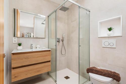 a bathroom with a shower and a toilet and a sink at Marce in Ciutadella