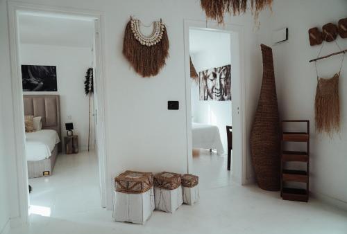 a room with white walls and a room with stools at Villa Carol in Illes Balears