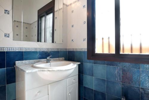 a bathroom with a sink and a mirror at Villa Perez Zara 3 in Campano