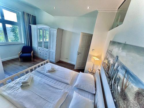 a bedroom with a large bed with an aquarium in it at Appartement Baltic Pearl in Ostseebad Sellin