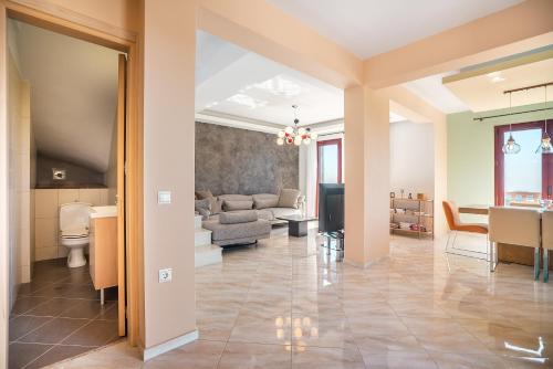 a living room with a couch and a table at Sky Hills in Rhodes Town