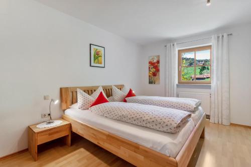 a bedroom with two beds and a window at Ferienwohnung Edelweiß in Bad Reichenhall