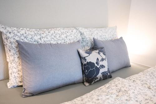a bunch of pillows sitting on a bed at Wiff's Studio in Mellau