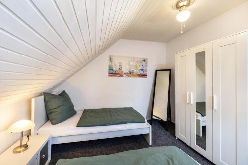a small room with a bed and a window at Lichtblick in Bottrop