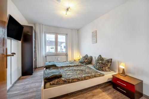 a bedroom with a large bed and a window at Fewo Nele in Gries