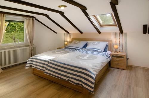 a bedroom with a bed and a window at Haus Schlossgarten in Hinte