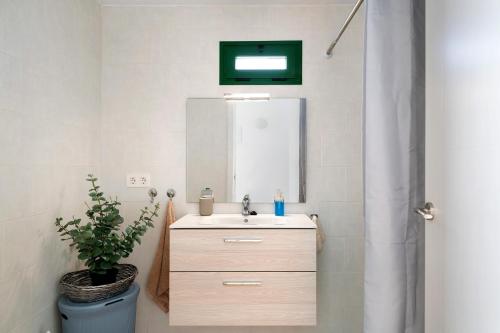 a bathroom with a sink and a mirror at San Roque 2 in Tinajo