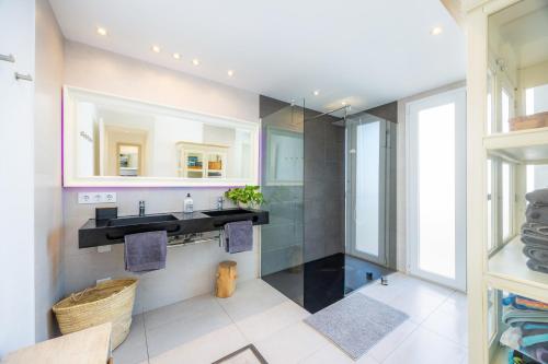 a bathroom with a sink and a mirror at Lagomar in Alcudia