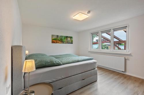 a bedroom with a bed and a window at Ferienwohnung K5 in Wehr